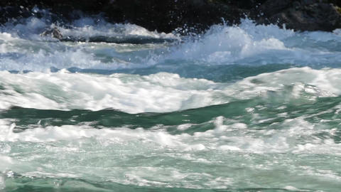 Wild runnig mountain river, foaming water rapids