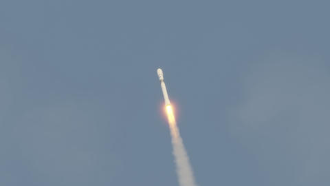 Commercial rocket launch into space with exhaust flames and smoke 4k
