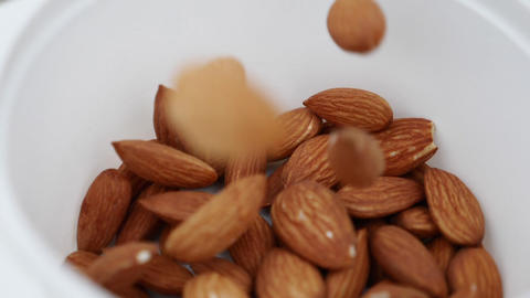 Super slow motion of flying almond nuts collision