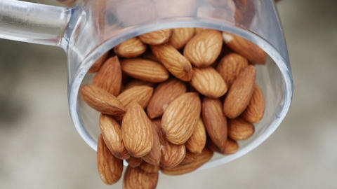Nut almond close up. product rich in minerals and vitamins. Almond turns in a shot