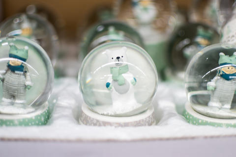 Souvenir snow globe with cute white bear