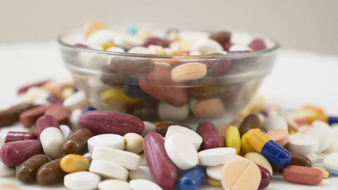pills or capsules close up - large amount of capsules rotating