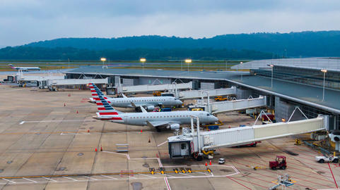 Aerial view of regional airport with terminal and airplanes