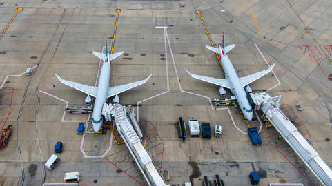 Aerial view of regional airport with terminal and airplanes