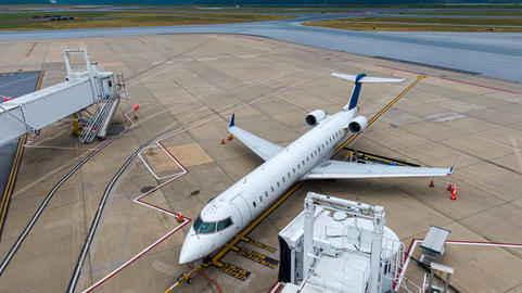 Aerial view of regional airport with terminal and airplanes