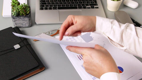 Business woman hands showing graph report during videocall on laptop close up zoom in