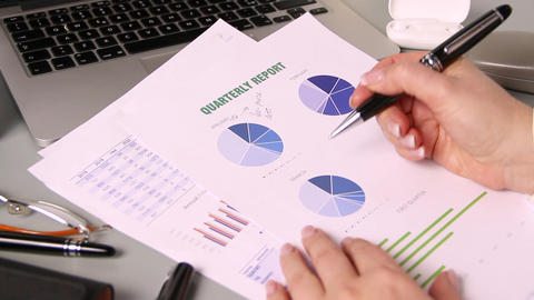 Business woman hands writing on report close up