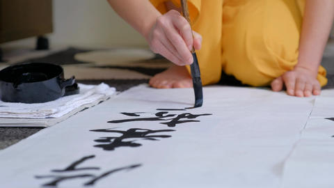 Japanese woman doing calligraphy