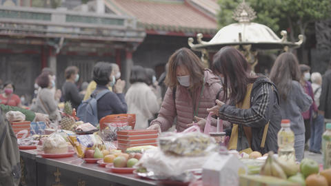 People placing offerings