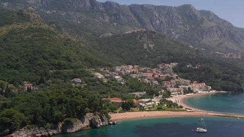 Green mountains and summer day and green trees and houses