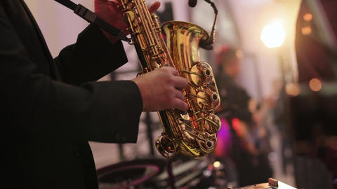 Musical band group playing song, performing on concert musician stage with
