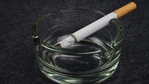cigarette burning gif Cigarette burning fast time lapse on black textured surface Glass  transparent