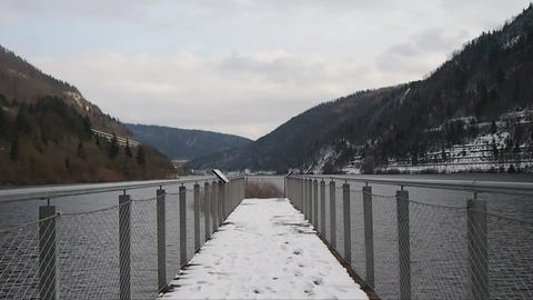 Snow covered bridge over a river in winter 019663100 1640639675