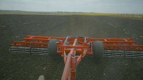 Harvesting in the field. Land cultivation with a tractor