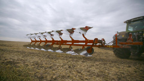Harvesting in the field. Land cultivation with a tractor