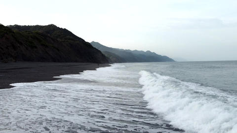 Drone flying over the black beach