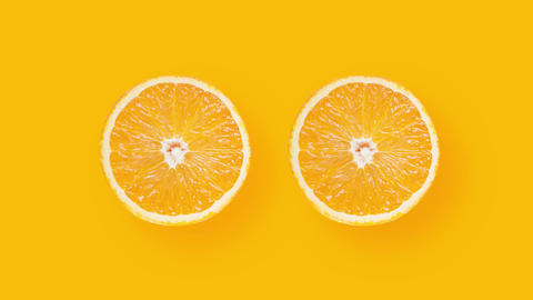 Two sliced tangerines rotating on orange background Top View 4K