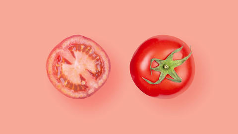 Two sliced ​​tomatoes rotating on red background Top View 4K-2