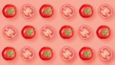 Many sliced tomatoes and many whole tomatoes rotating on red background Top View 4K