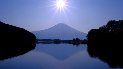 Sunrise sun and Mt. Fuji from Lake Tanuki