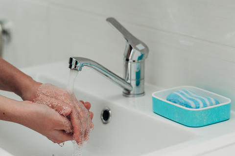 The Girl Washes Her Hands to Avoid Infection With the Virus COVID-19
