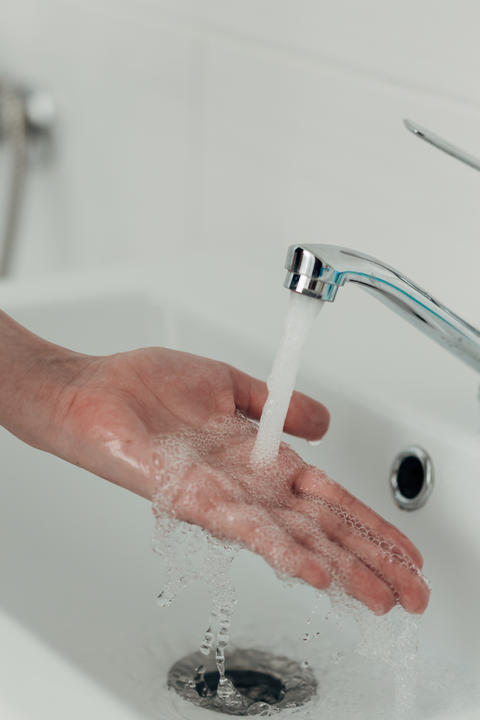 The Girl Washes Her Hands to Avoid Infection With the Virus COVID-19