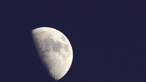 moon rising. telephoto lens real shot with flickering atmosphere. speeded up