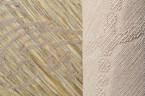 Front and back side of multi-colored rug with embossed pattern