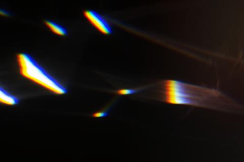 Light leak effect on a black background wallpaper