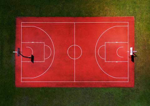 Red basketball court with marking lines