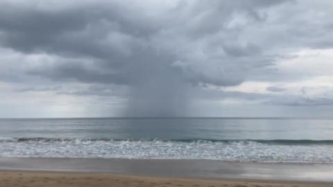 the rain storm in the sea with the grey cloudy