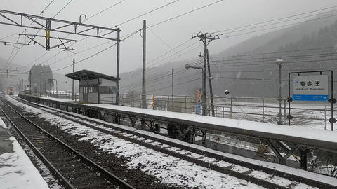 Express train passing through a winter station
