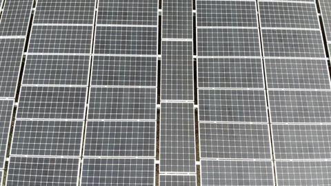 Aerial view Panorama of solar panels. Slow movement of the camera over the