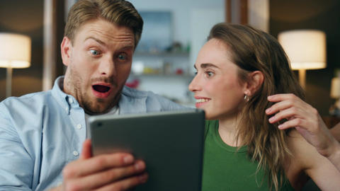 Amazed family watching tab screen at house zoom on. Shoc GIF 24831926 ...