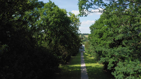 Aerial top down view from the drone on the narrow passageway leading to a small