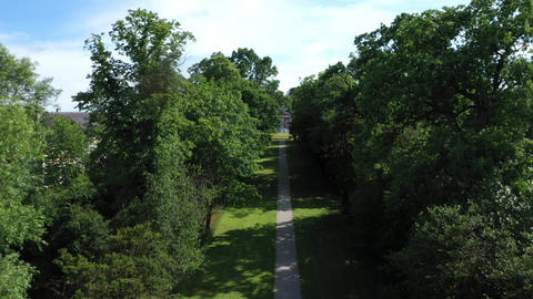 Aerial top down view from the drone on the narrow passageway leading to a small