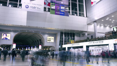 People coming and going inside the station