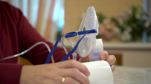 The inhaler device is on the table. The man tak Animated GIF 28312046 ...