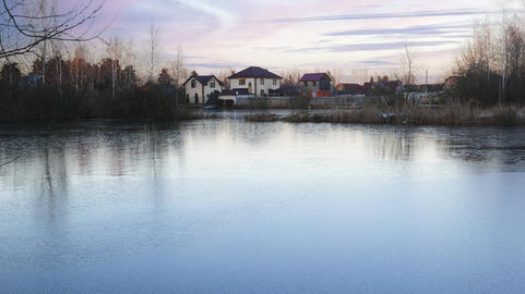 Evening View of a Frozen Village Pond