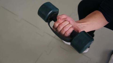 A man with weights in the gym. Fitness club