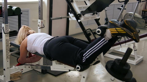 Fat woman on the machine at the gym