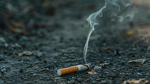 cigarette smoke trail A cigarette producing smoke that curls and dances above it, A trail of smoke