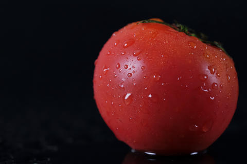Ripe, fresh, delicious looking red tomatoes, water droplets