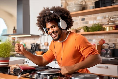A man with headphones is cooking in the kitchen created with Generative AI technology