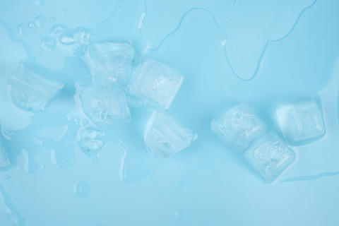 transparent clean ice cubes on a blue background