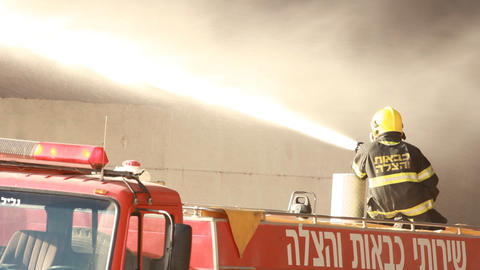 firefighters battle blaze in packaging factory