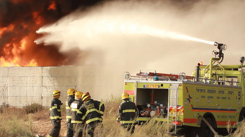 firefighters battle blaze in packaging factory