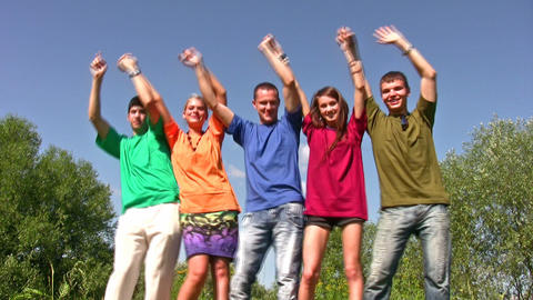 dancing friends with hands up