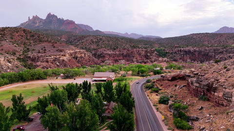 One car traveling through rugged mountain scenery