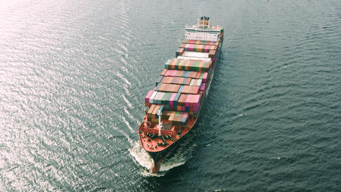 Container vessel floating in sea